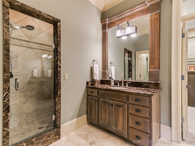 full bathroom featuring a stall shower, vanity, and ornamental molding