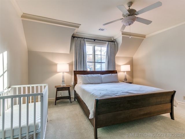 bedroom with visible vents, baseboards, ornamental molding, ceiling fan, and carpet flooring