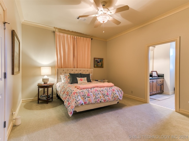 carpeted bedroom featuring visible vents, a ceiling fan, baseboards, and ornamental molding