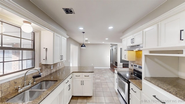 kitchen featuring white cabinetry, stainless steel electric range oven, and sink