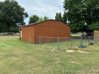 view of outbuilding with a lawn