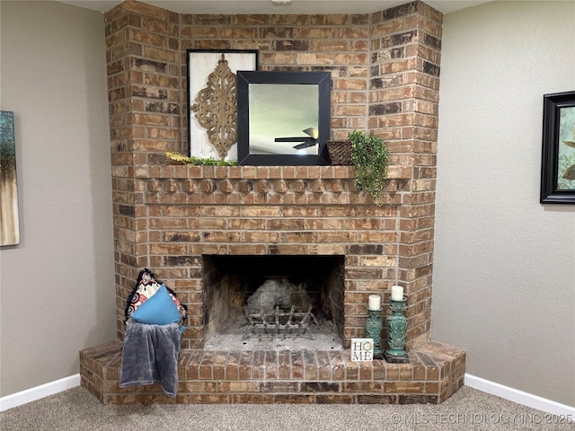 115 Spruce St, Ardmore, OK 73401 - detailed view of carpet floors, baseboards, and a brick fireplace