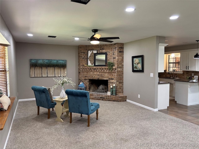 115 Spruce St, Ardmore, OK 73401 - living area with ceiling fan, carpet flooring, recessed lighting, baseboards, and a brick fireplace