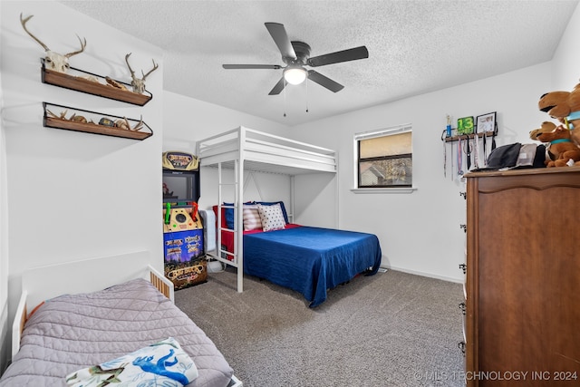 carpeted bedroom with a textured ceiling and ceiling fan