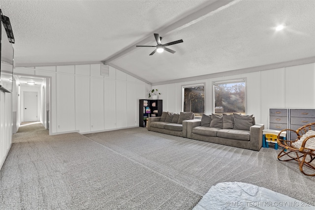 living room with ceiling fan, a textured ceiling, vaulted ceiling with beams, and carpet floors