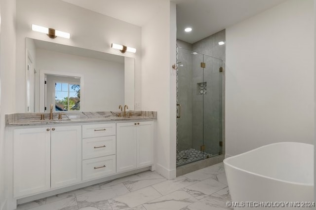 bathroom featuring vanity and plus walk in shower