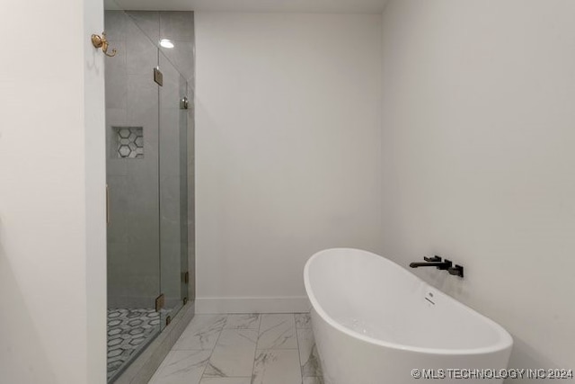 bathroom with independent shower and bath