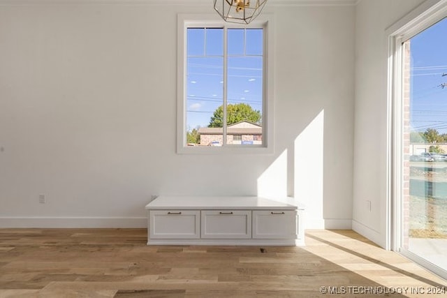 room details featuring hardwood / wood-style flooring and a notable chandelier