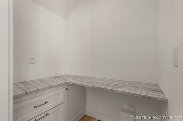 laundry area with light hardwood / wood-style flooring