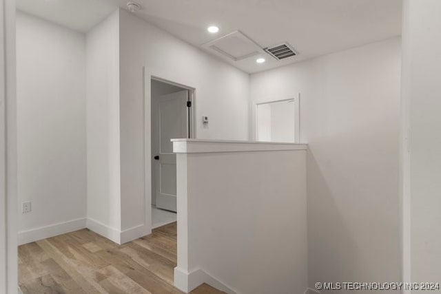 corridor featuring light hardwood / wood-style floors