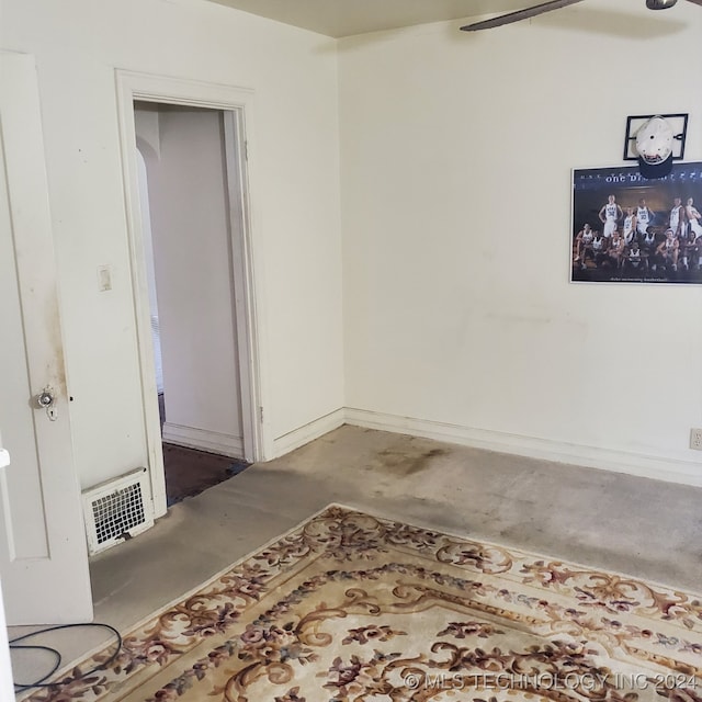 spare room featuring concrete flooring