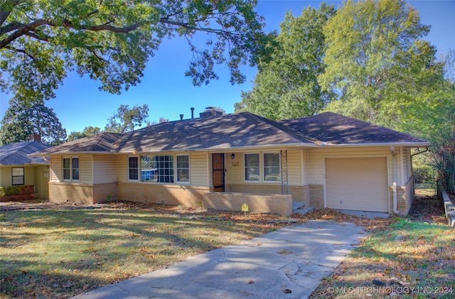 single story home with a front lawn, a garage, and a porch