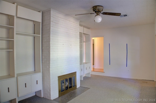 unfurnished living room featuring ceiling fan and carpet