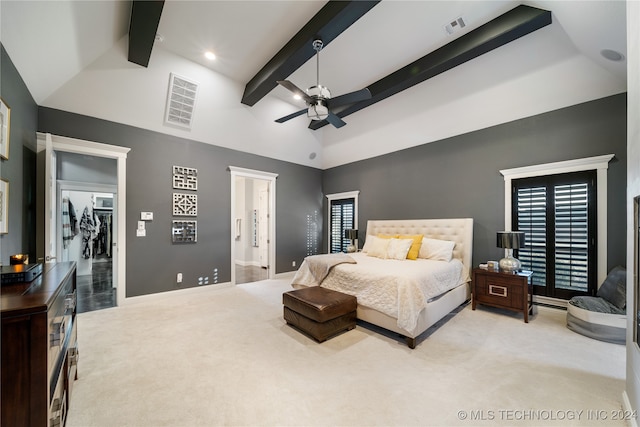 carpeted bedroom with a closet, ensuite bath, beam ceiling, high vaulted ceiling, and ceiling fan