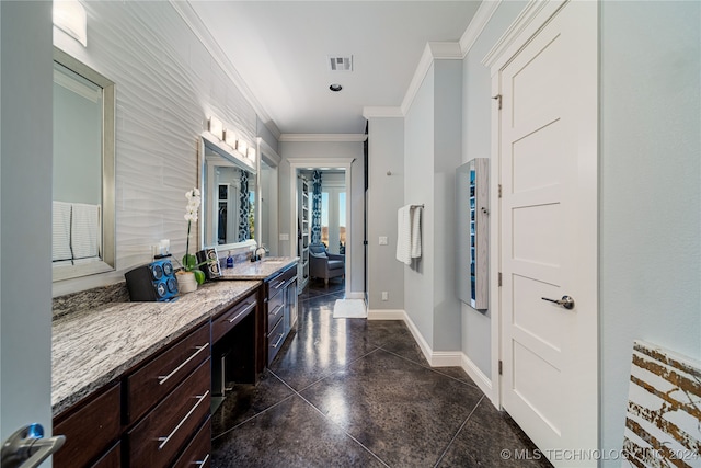 bathroom featuring vanity and ornamental molding