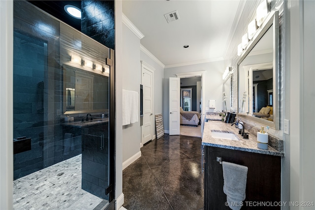 bathroom with vanity, tiled shower, and crown molding