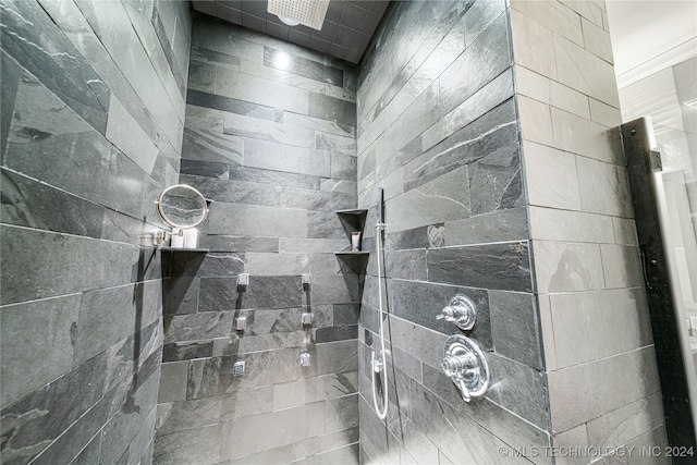 bathroom with tiled shower