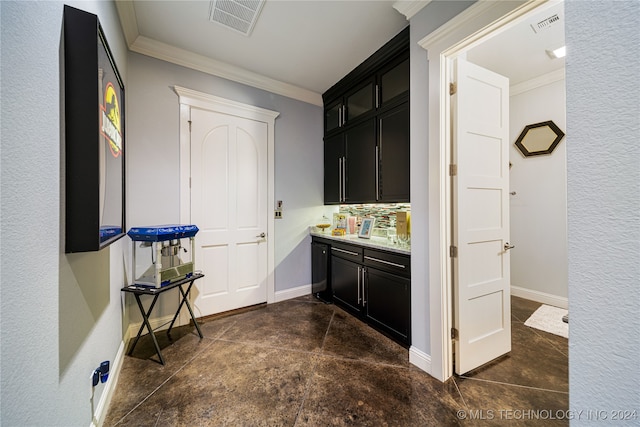 bar featuring crown molding