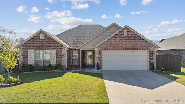 view of front facade with a front lawn and a garage