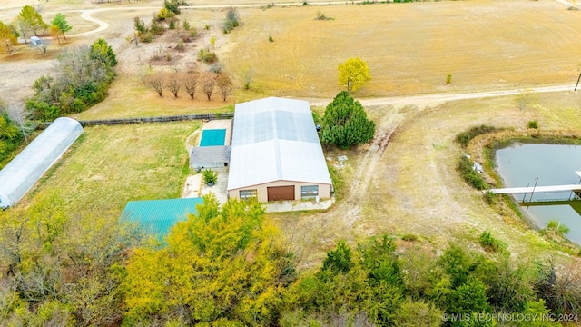 aerial view with a water view and a rural view