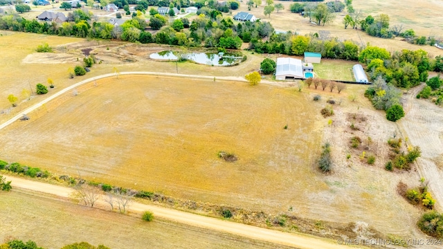 aerial view with a water view and a rural view