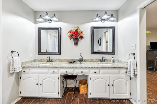 bathroom with vanity and hardwood / wood-style flooring