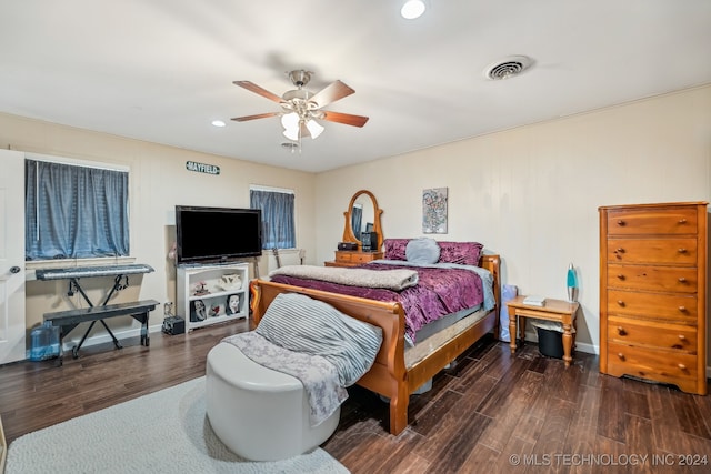 bedroom with dark wood-type flooring and ceiling fan