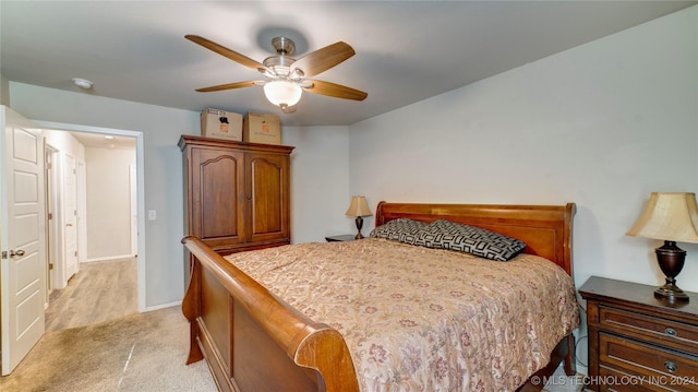 bedroom with ceiling fan and light colored carpet