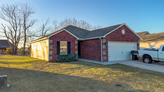 single story home featuring a garage and a front lawn