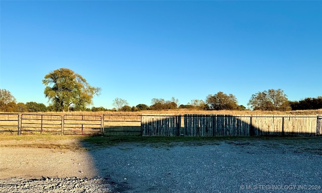 view of gate featuring a rural view