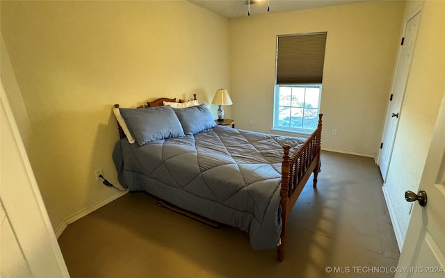 bedroom with concrete floors