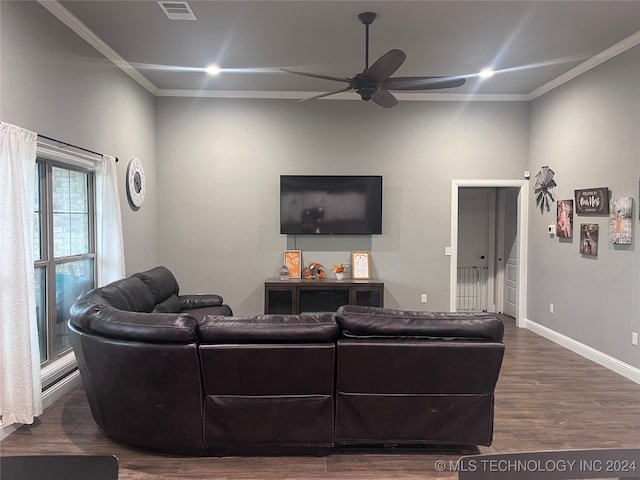 living room featuring ornamental molding, ceiling fan, and dark hardwood / wood-style floors