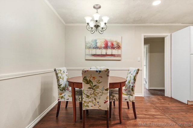 dining area with a notable chandelier, dark wood-type flooring, and crown molding