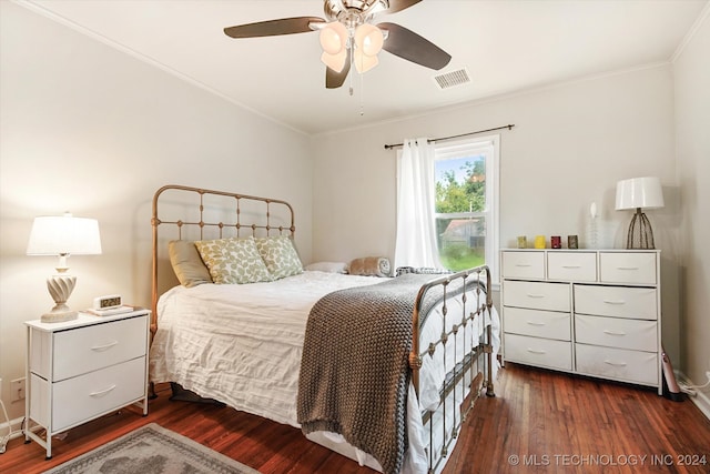 bedroom featuring crown molding, ceiling fan, and dark hardwood / wood-style floors