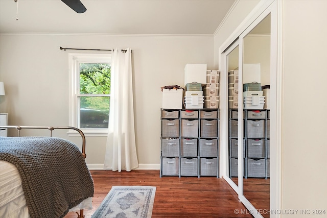 bedroom with hardwood / wood-style floors, ceiling fan, and crown molding