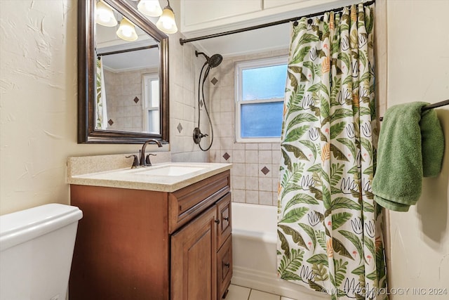 full bathroom featuring vanity, tile patterned floors, toilet, and shower / tub combo