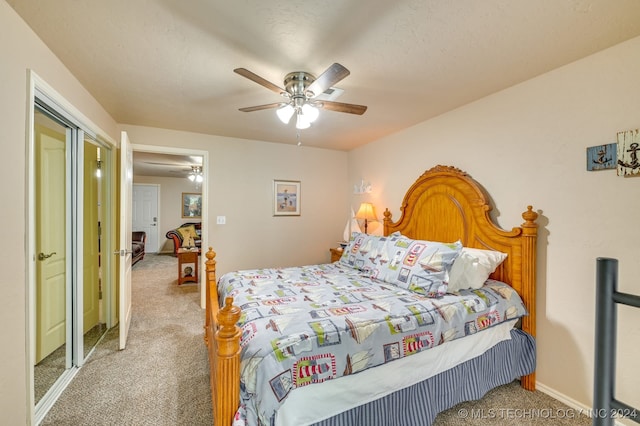 bedroom featuring ceiling fan and carpet flooring