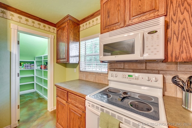 kitchen with white appliances, decorative backsplash, and ornamental molding