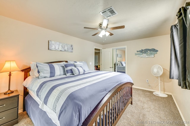 bedroom featuring light colored carpet and ceiling fan