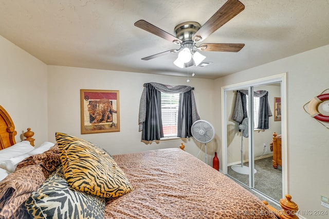 bedroom featuring ceiling fan, a closet, and carpet floors