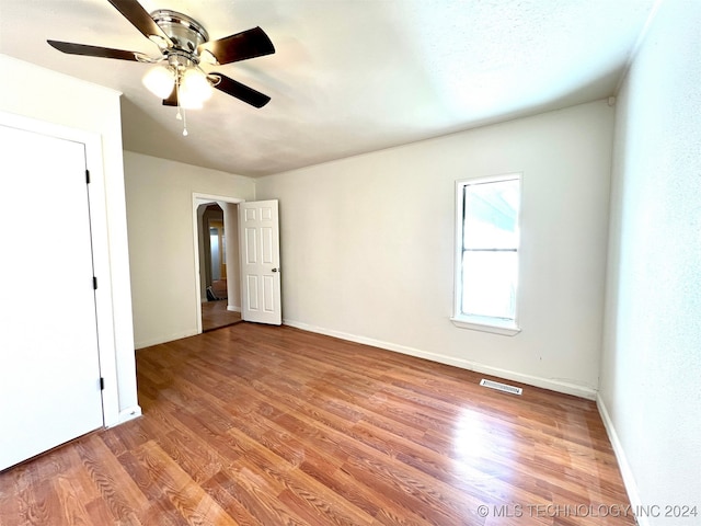 unfurnished bedroom with light hardwood / wood-style flooring and ceiling fan