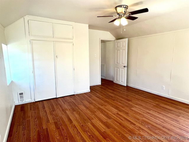 unfurnished bedroom featuring ceiling fan, vaulted ceiling, and wood-type flooring