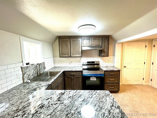 kitchen featuring dark brown cabinets, sink, lofted ceiling, and electric range