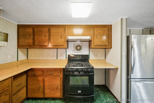 kitchen with stainless steel fridge, ornamental molding, black gas range oven, and ventilation hood