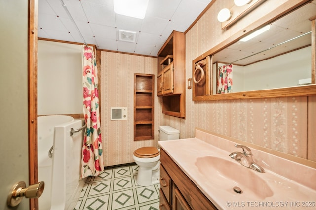 full bathroom featuring vanity, toilet, and shower / tub combo