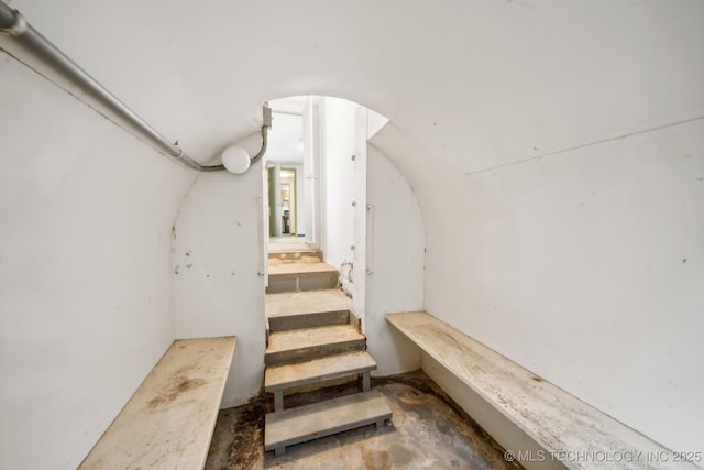 stairs with concrete floors