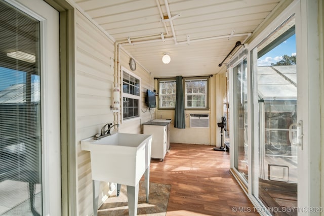 sunroom / solarium featuring cooling unit