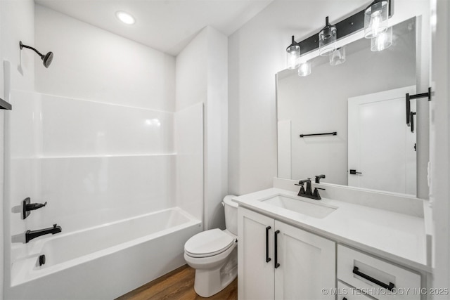 full bathroom featuring vanity, toilet, shower / bath combination, and wood-type flooring