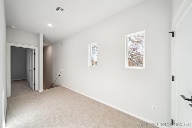 carpeted spare room with plenty of natural light