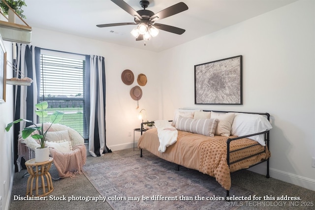carpeted bedroom with baseboards and a ceiling fan